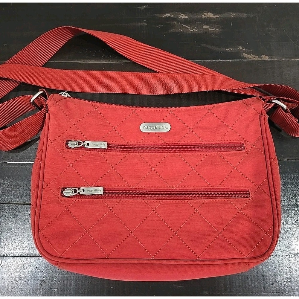 Baggallini Wanderer Quilted Crossbody Bag in a rust color.